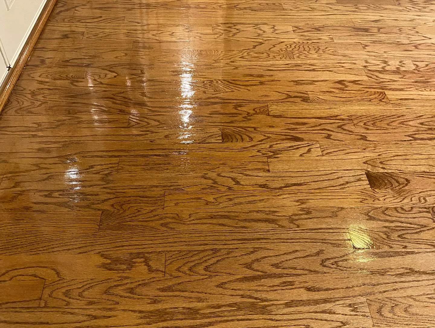 Hardwood floor refinishing highlighting smooth sanding results