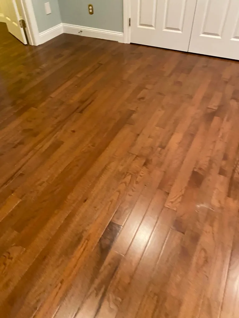 Finished view of a hallway and closet doors following the oak hardwood flooring installation.